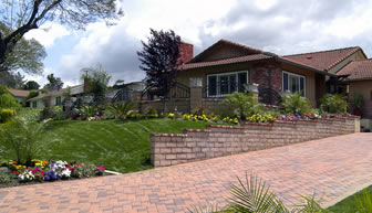 Block pavior driveway complimented with landscape gardens and new retaining wall