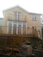 Large extension job with bedroom veranda and decking area leading to garden