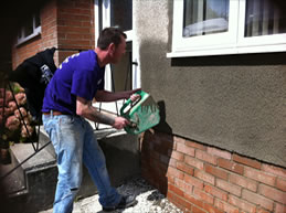 Repairing the render to the front of a property in Totnes